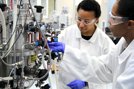 Image of Students Working with Bioreactor